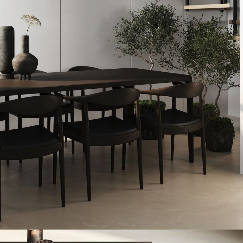 Dark dining table with two potted olive trees sitting behind it, Ormeau home styled for sale Brett Reddell Area Specialist Ormeau Hills Real Estate. 